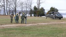 Marines with Logistics Platoon, Chemical Biological Incident Response Force, CBIRF, speak to an Army pilot of An UH-60 Blackhawk helicopter assigned to 12th Aviation Battalion, U.S. Army, prior to a sling load operation as part of Initial Reaction Force B certification exercise, CERTEX, aboard Naval Support Facility Indian Head Annex Stump Neck, Md., Dec. 13, 2016. This CERTEX evaluated all sections composing the IRF including identification and detection, technical rescue, decontamination, search and rescue/casualty extraction, medical, explosive ordnance disposal, as well as command and control.  (Official U.S. Marine Corps photo by Staff Sgt. Santiago G. Colon Jr./RELEASED)
