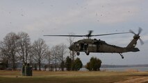 Embarkation specialist Marines with Chemical Biological Incident Response Force, CBIRF, prepare to attach a container of supplies to an UH-60 Blackhawk helicopter assigned to 12th Aviation Battalion, U.S. Army, during a sling load operation as part of Initial Reaction Force B certification exercise, CERTEX, aboard Naval Support Facility Indian Head Annex Stump Neck, Md., Dec. 13, 2016. This CERTEX evaluated all sections composing the IRF including identification and detection, technical rescue, decontamination, search and rescue/casualty extraction, medical, explosive ordnance disposal, as well as command and control.  (Official U.S. Marine Corps photo by Staff Sgt. Santiago G. Colon Jr./RELEASED)
