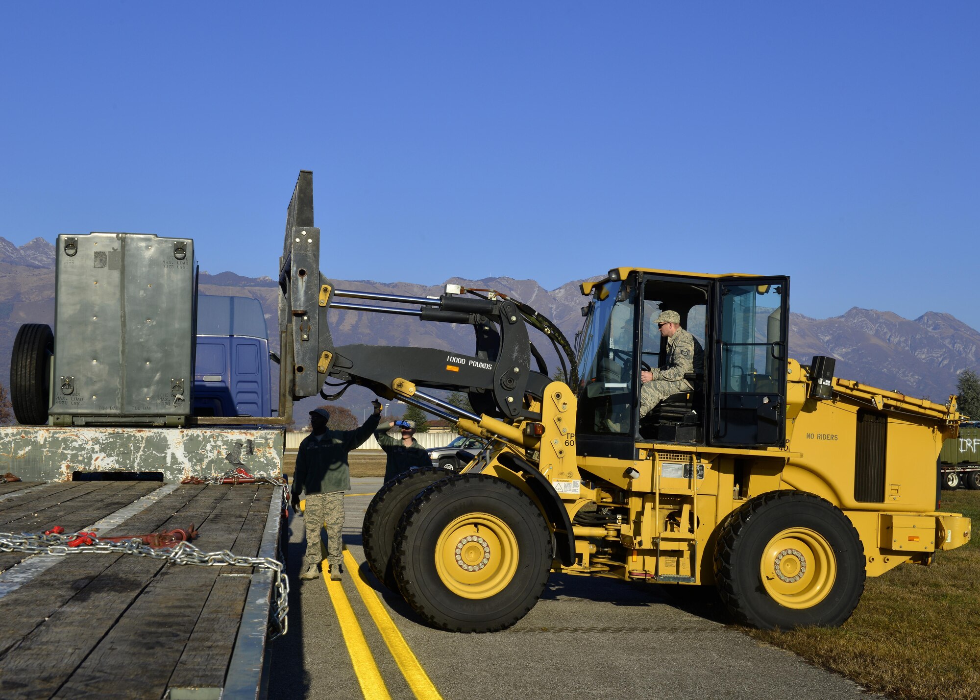 Staff Sgt. Lee Thorpe, 31st Civil Engineer Squadron heavy equipment operator, operates a forklift during an exercise at Aviano Air Base, Italy on Dec. 15, 2016. The exercise was designed to test Team Aviano’s capabilities. (U.S. Air Force photo by Senior Airman Cary Smith)