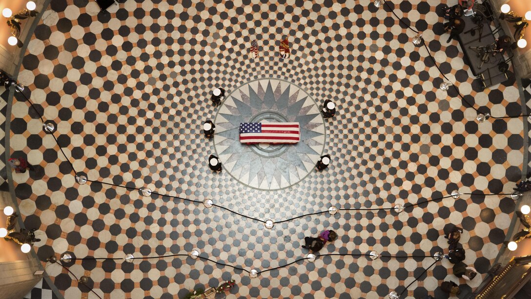U.S. Marines with Marine Barracks Washington stand guard during the repose of Sen. John H. Glenn, Jr., at the Ohio Statehouse, Columbus, Ohio, Dec. 16, 2016. Having flown 149 combat missions in World War II and the Korean War, John Glenn became the first man to orbit the earth in 1962. After retiring from the space program, Glenn was elected to the Ohio State Senate in 1974. 