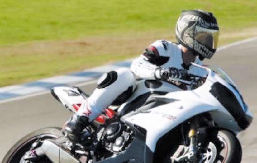 Air Force Senior Airman William Johnson, an occupational safety specialist with the 60th Air Mobility Wing, rides his motorcycle Oct. 14 at the Thunderhill Raceway in Willows, Calif. Johnson has been riding motorcycles for five years and regularly teaches motorcycle safety courses at Travis Air Force Base, Calif. Courtesy photo