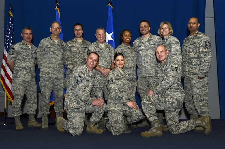 U.S. Air Force Lt. Gen. (Dr.) Mark Ediger, U.S. Air Force Medical Service Corps surgeon general, and Chief Master Sgt. Jason Pace, U.S. Air Force Medical Service Corps chief medical enlisted force surgeon general, pose for a group photo with the 2016 Air Combat Command Medical Service Award winners during an all call at Joint Base Langley-Eustis, Va., Dec. 15, 2016. During the all call, Ediger stressed how Air Force medics enable mission readiness. (U.S. Air Force photo by Airman 1st Class Kaylee Dubois.)