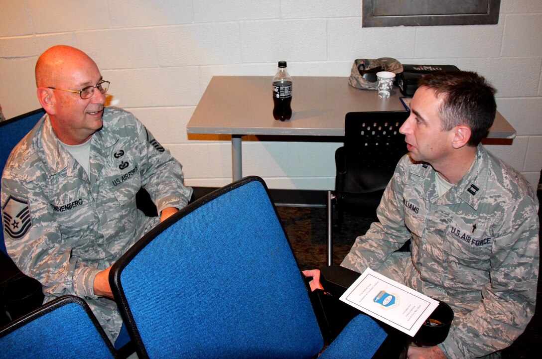 At left, 932nd Airlift Wing historian Master Sgt. Gerald Sonnenberg, talks about past and upcoming wing activities with Chaplain (Capt.) Mike Williams during the Unit Training Assembly, December 4, 2016, Scott Air Force Base, Illinois.  The two are part of the wing staff agencies that serve approximately 1,100 members of the Air Force Reserve Command's unit based at Scott Air Force Base, Ill.  (U.S. Air Force photo by Lt. Col. Stan Paregien)