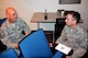At left, 932nd Airlift Wing historian Master Sgt. Gerald Sonnenberg, talks about past and upcoming wing activities with Chaplain (Capt.) Mike Williams during the Unit Training Assembly, December 4, 2016, Scott Air Force Base, Illinois.  The two are part of the wing staff agencies that serve approximately 1,100 members of the Air Force Reserve Command's unit based at Scott Air Force Base, Ill.  (U.S. Air Force photo by Lt. Col. Stan Paregien)