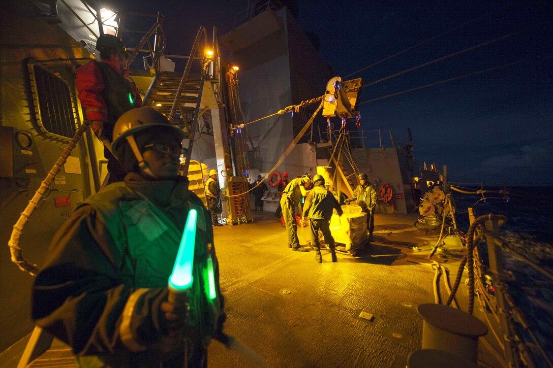 Sailors participate in a replenishment aboard the USS Roosevelt in the Mediterranean Sea, Dec. 12, 2016. The guided-missile destroyer is conducting naval operations in the U.S. 6th Fleet area of operations to support U.S. national security interests in Europe. Navy photo by Petty Officer 3rd Class Taylor A. Elberg
