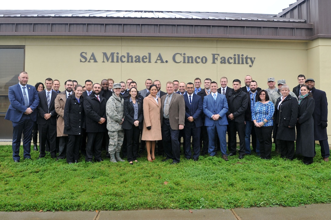 Air Force Office of Special Investigations members gather outside the newly dedicated SA Michael A. Cinco Facility, at Beale Air Force Base, Calif.,  following its dedication Dec. 14, 2016, to the memory of the Fallen Agent killed in action Dec. 21, 2015 near Bagram Air Field, Afghanistan. (U. S. Air Force photo/Airman Tristan D. Viglianco, 9 RW/PA)   