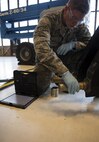 Airman 1st Class Tage Sickler 92nd Maintenance Squadron hydraulics systems apprentice, prepares to attach the ruddervators to the refueling boom Dec. 16, 2016, at Fairchild Air Force Base, Wash. There are two slots on either side of the torque tube where bolts can go through, keeping the ruddervator from rotating within the bell crank, allowing the ruddervator to be controlled. (U.S. Air Force photo/ Airman 1st Class Sean Campbell)