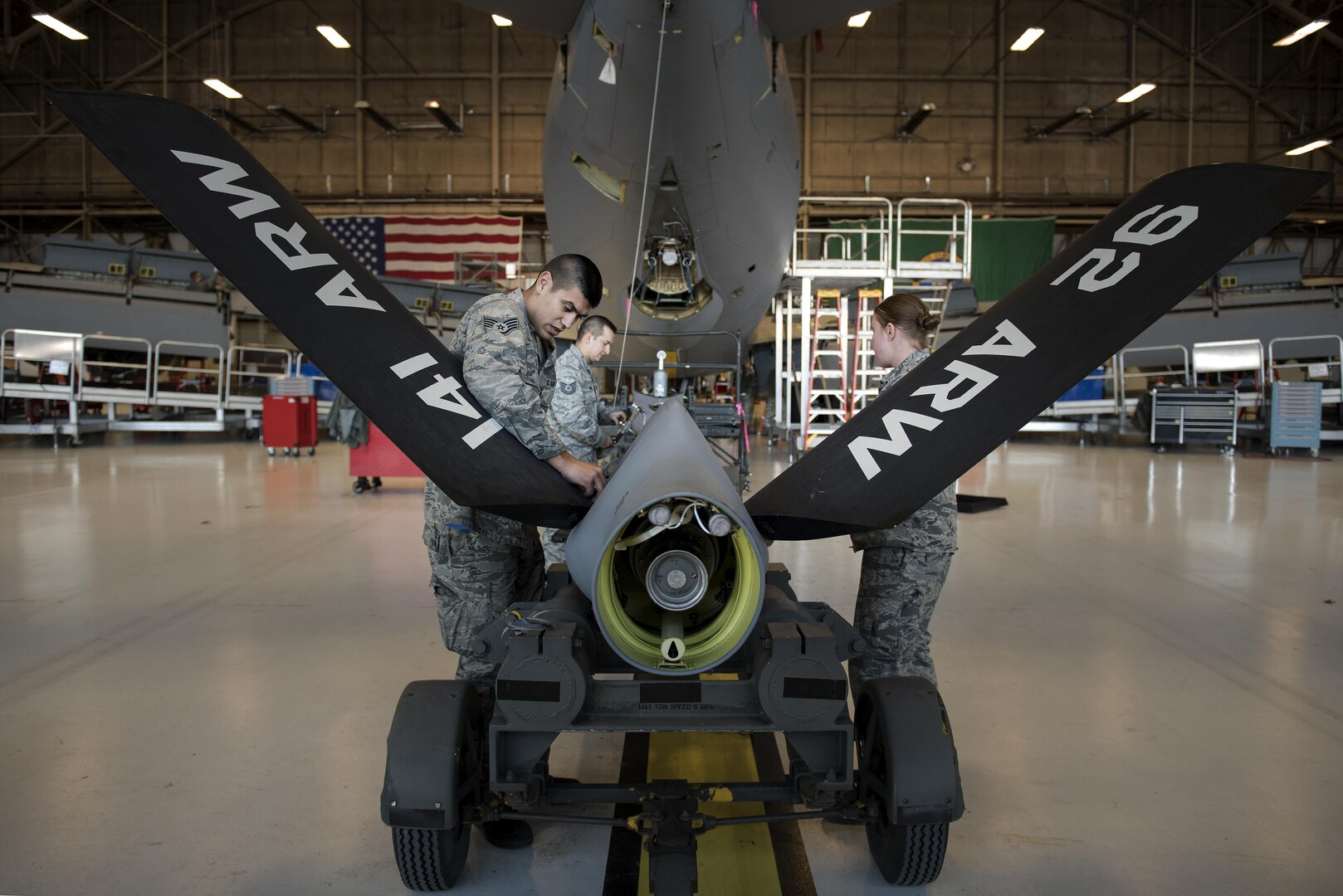 Airmen from the 92nd Maintenance Squadron hydraulics shop prepare a refueling boom to be attached to a KC-135 Stratotanker Dec. 16, 2016, at Fairchild Air Force Base, Wash. This spring, Airmen from the 92nd Maintenance Squadron hydraulics shop were called to fix a KC-135 with an improperly installed boom ruddervator torque tube, which secures the ruddervators to the tanker’s refueling boom. (U.S. Air Force photo/ Airman 1st Class Sean Campbell)