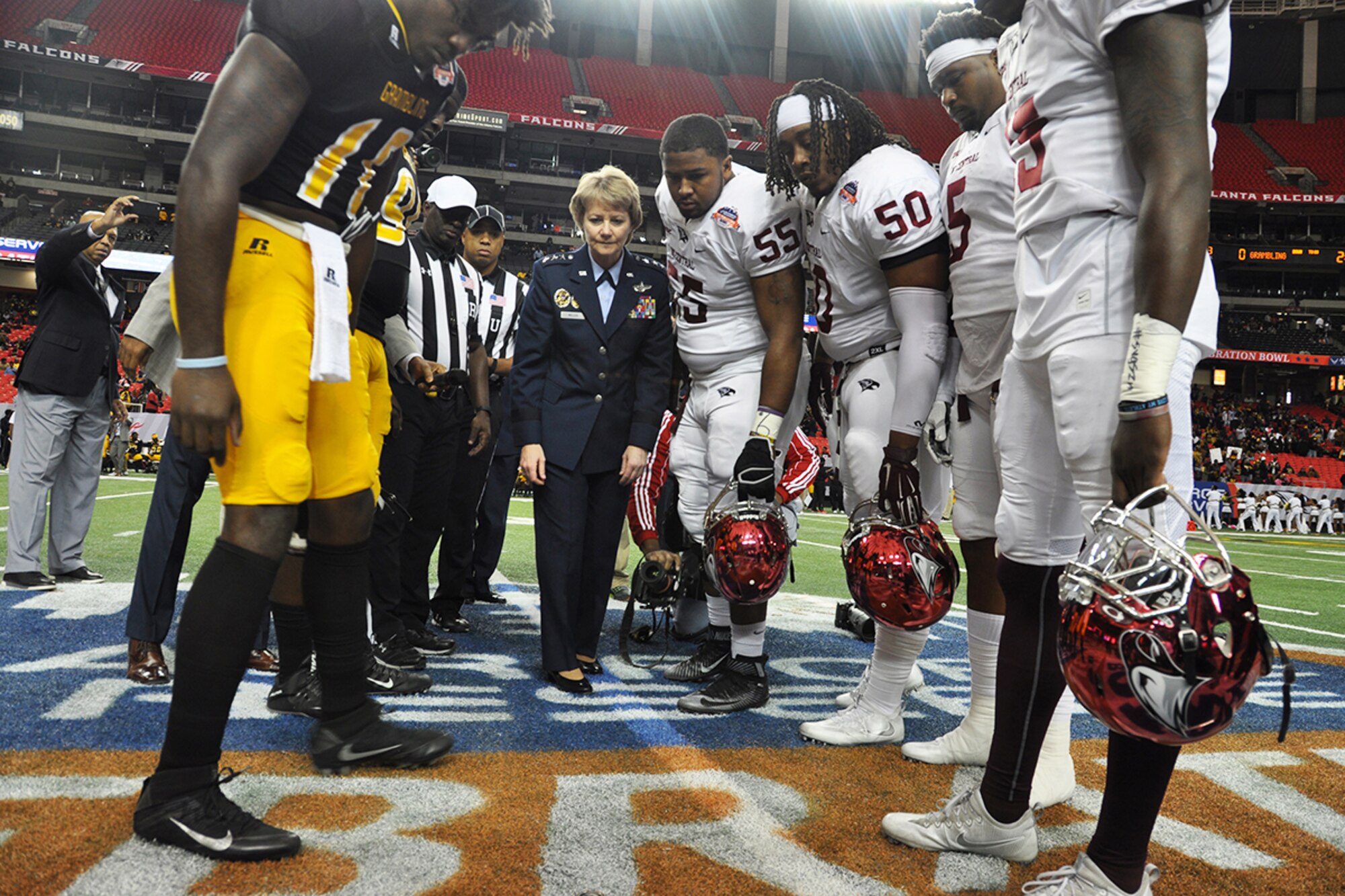 Lt. Gen. Maryanne Miller, chief of the Air Force Reserve and commander of Air Force Reserve Command, conducts the coin toss prior to the Air Force Reserve Celebration Bowl football game between the Grambling State University Tigers and the North Carolina Central University Eagles.  (U.S. Air Force photo/Master Sgt. James Branch)