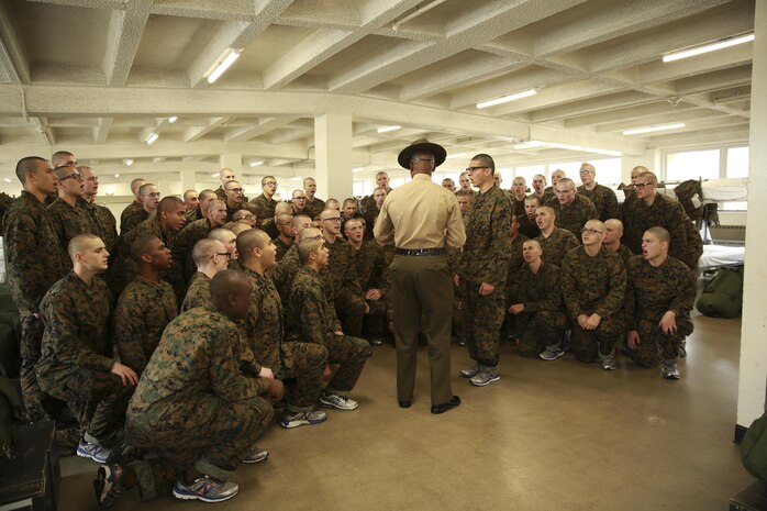 Recruits from Hotel Company, 2nd Recruit Training Battalion, receive instructions from their senior drill instructor during pick up at Marine Corps Recruit Depot San Diego, Dec. 17. The recruits will spend their first day with their drill instructors learning the rules and regulations of recruit training, regarding everything from how to act in the squad bay to how to speak to drill instructors. Annually, more than 17,000 males recruited from the Western Recruiting Region are trained at MCRD San Diego. Hotel Company is scheduled to graduate March 10. 