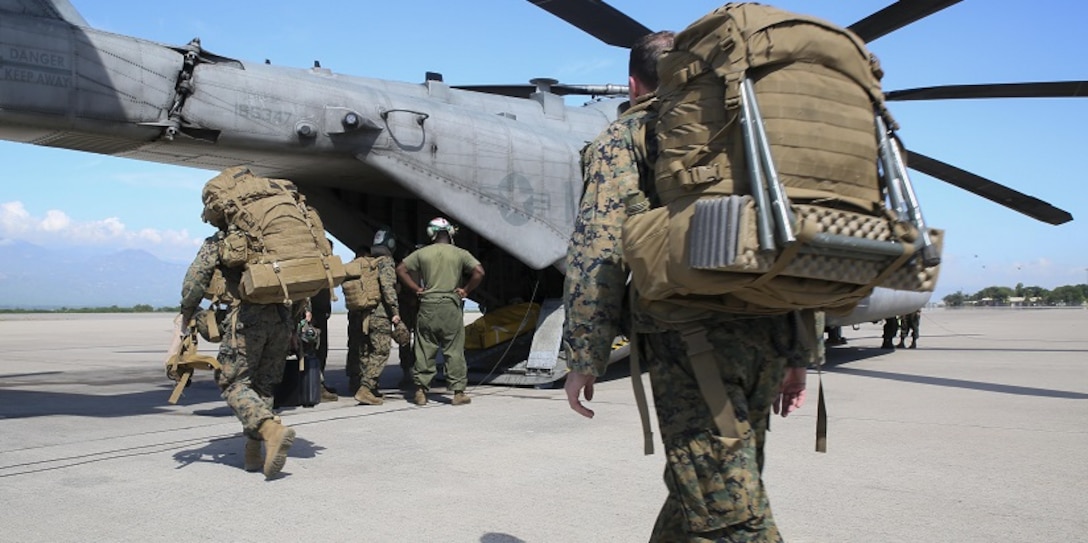 Marines with Special Purpose Marine Air-Ground Task Force Southern Command embark aboard CH-53E Super Stallion and depart to Grand Cayman Island at Soto Cano Air Base, Honduras 4 Oct. 2016. The SPMAGTF-SC is part of U.S southern Command response team staged at Cayman Island, ready to support U.S disaster relief operations in the Caribbean in response to Hurricane Matthew. SPMATF-SC deployed to Central America in June to serve as a rapid response force during the hurricane season. (United States Marine Corps photo by Sgt. Ian Ferro/Released)