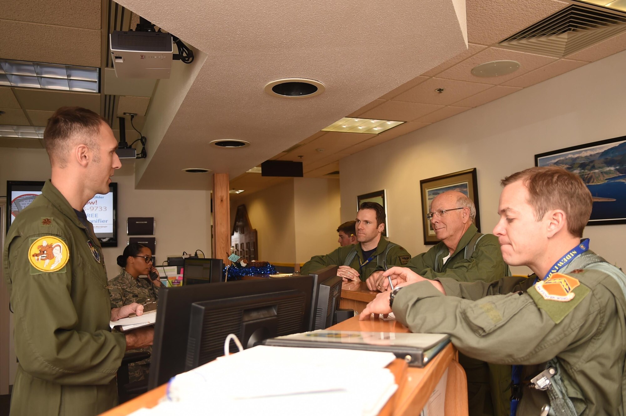 Maj. Brent Ellis (left), 311th Fighter Squadron fighter pilot, briefs U.S. Rep. Steve Pearce (middle right), New Mexico 2nd district, and Maj.’s Matthew Marshall and David Feth, 54th Fighter Squadron fighter pilots, prior to stepping to the aircraft, Dec. 16, 2016, Holloman Air Force Base, N.M. Pearce was offered an orientation flight on the F-16 Fighting Falcon, to better understand the capabilities and mission of the F-16. (U.S. Air Force photo by Tech. Sgt. Amanda N. Junk)