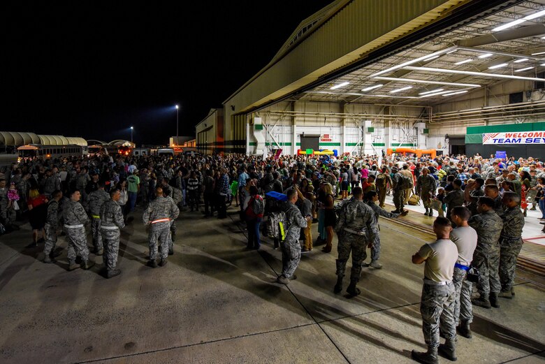 More than 200 friends and family greeted Airmen who recently returned from deployment Oct. 17, 2016, at Seymour Johnson Air Force Base, North Carolina. More than 300 Airmen from the 4th Maintenance Group and 335th Fighter Squadron were met with cheers from loved ones upon their arrival. (U.S. Air Force photo by Airman Shawna L. Keyes)