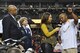 Lt. Gen. Maryanne Miller, chief of Air Force Reserve and commander of Air Force Reserve Command; John T. Grant, event executive director; and ESPN announcer Tiffany Greene congratulate Broderick Fobbs, Grambling State University head football coach, on his team winning the Air Force Reserve Celebration Bowl Dec. 17 at the Georgia Dome in Atlanta. (U.S. Air Force photo/Master Sgt. James Branch)