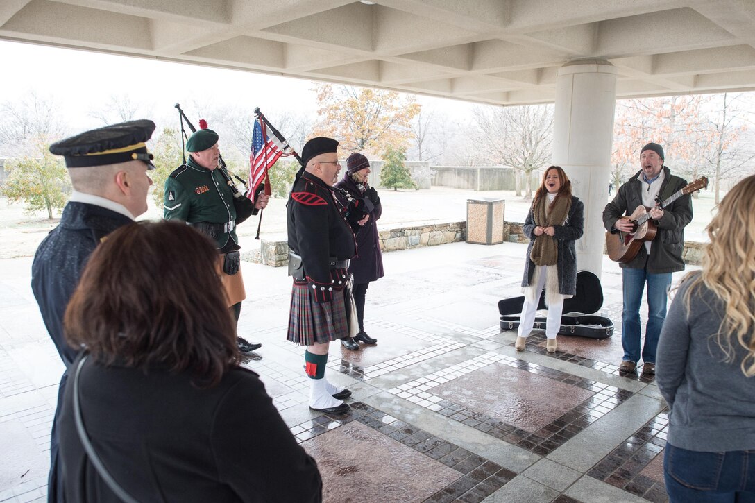 pArmy Command Sgt. Maj. John W. Troxell, left, senior enlisted advisor to the chairman of the Joint Chiefs of Staff, and his wife, Sandra, listen to musicians play during a wreath-laying ceremony as part of Wreaths Across America at Arlington National Cemetery in Arlington, Va., Dec. 17, 2016. DoD photo by Army Sgt. James K. McCann