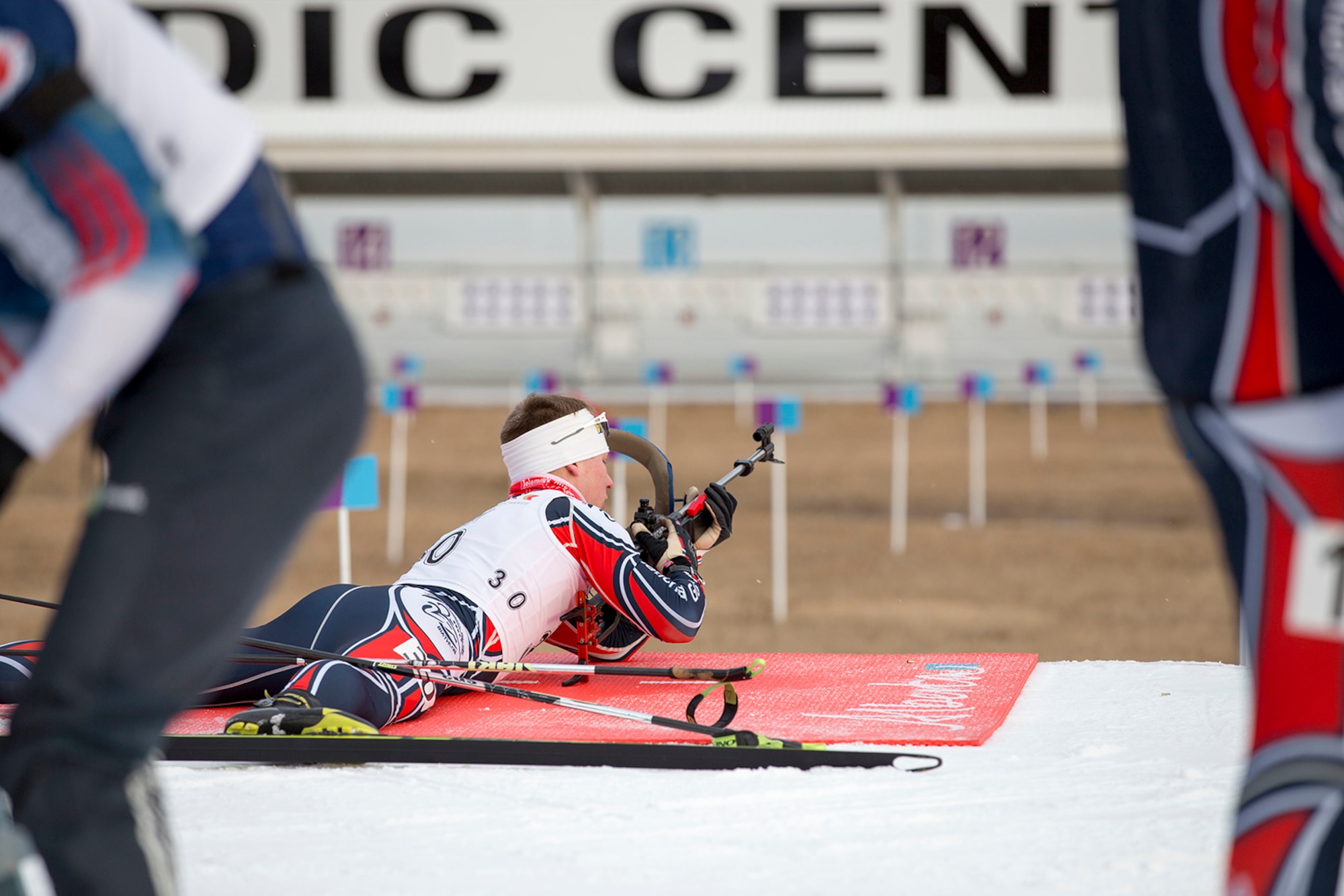 Alaska Army Guardsman Pfc. Travis Cooper, a construction equipment mechanic with the 207th Engineer Utility Detachment, zeros in his rifle before competing and winning the junior men’s 10 km sprint in the North American #1 and Calforex #1 Biathlon Cups at the Canmore Nordic Centre Provincial Park in Canmore, Alberta, Dec. 3, 2016. Cooper, 20, of Kenai, also took first place in the junior men’s 12.5 km mass start the following day. Cooper trains year-round and competes on the National Guard Biathlon development team. (U.S. Army National Guard photo by Staff Sgt. Balinda O’Neal Dresel)