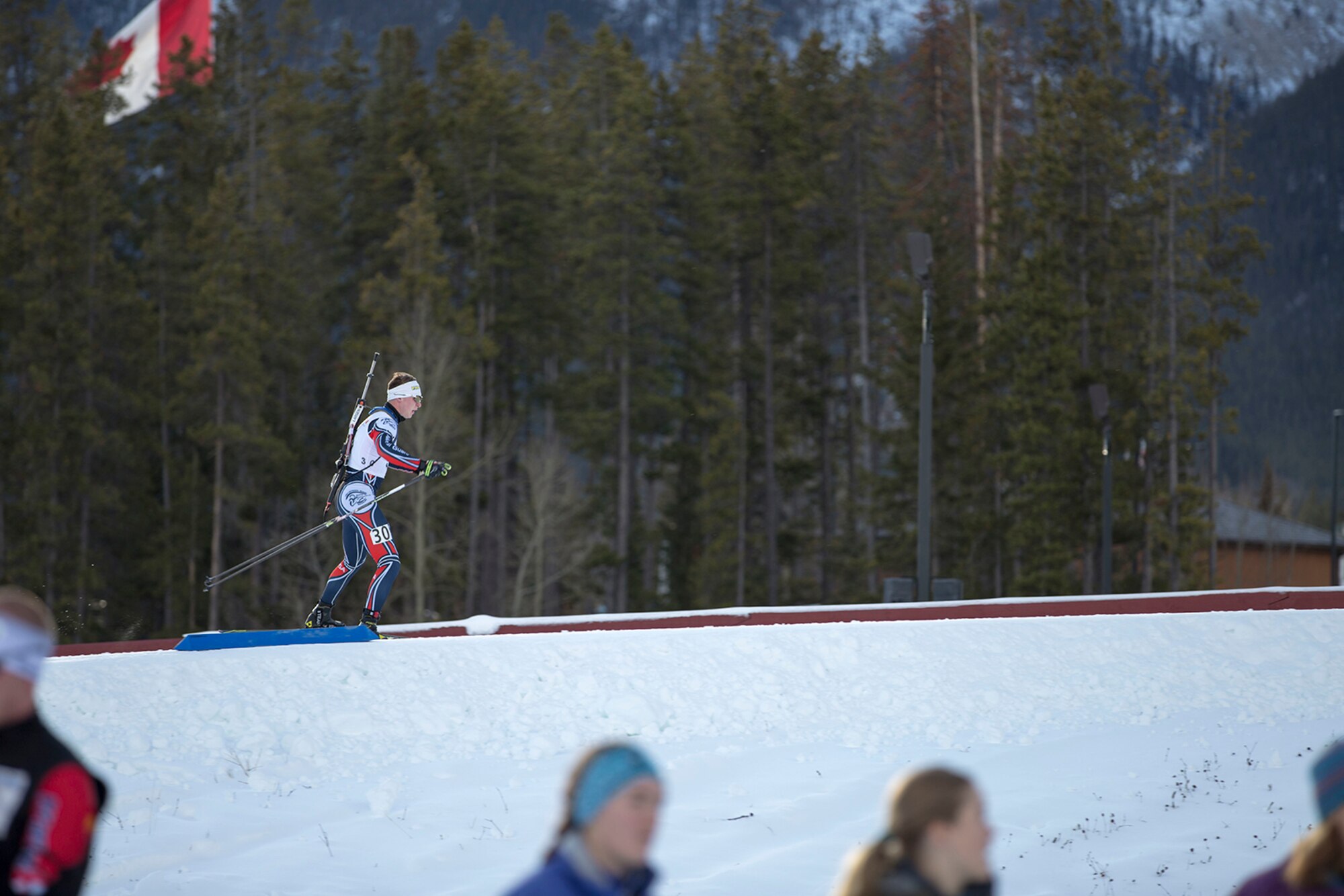 Alaska Army Guardsman Pfc. Travis Cooper, a construction equipment mechanic with the 207th Engineer Utility Detachment, competes in the North American #1 and Calforex #1 Biathlon Cups at the Canmore Nordic Centre Provincial Park in Canmore, Alberta, Dec. 3, 2016. Cooper, 20, of Kenai, took first place in both the junior men’s 10 km sprint and 12.5 km mass start during the two-day competition. Cooper trains year-round and competes on the National Guard Biathlon development team. (U.S. Army National Guard photo by Staff Sgt. Balinda O’Neal Dresel)