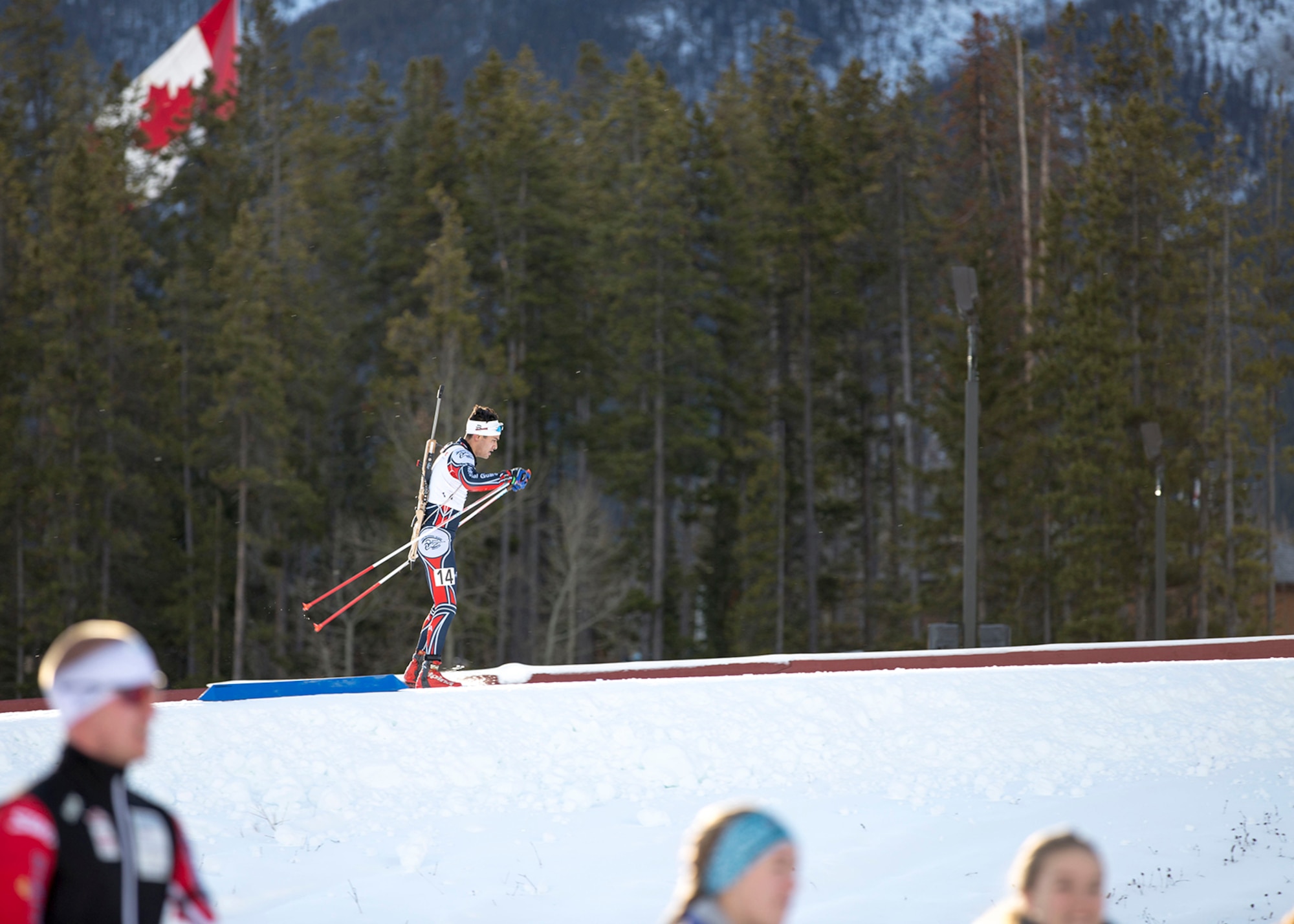 Alaska Guardsman Spc. Tahdg Nakada, a signal support specialist with Headquarters and Headquarters Company, 1st Battalion, 207th Aviation Regiment, competes in the North American #1 and Calforex #1 Biathlon Cups at the Canmore Nordic Centre Provincial Park in Canmore, Alberta, Dec. 3, 2016. Nakada, 22, of Anchorage, placed 15th overall in both the men’s 10 km sprint and 15 km mass start during the two-day competition. (U.S. Army National Guard photo by Staff Sgt. Balinda O’Neal Dresel)