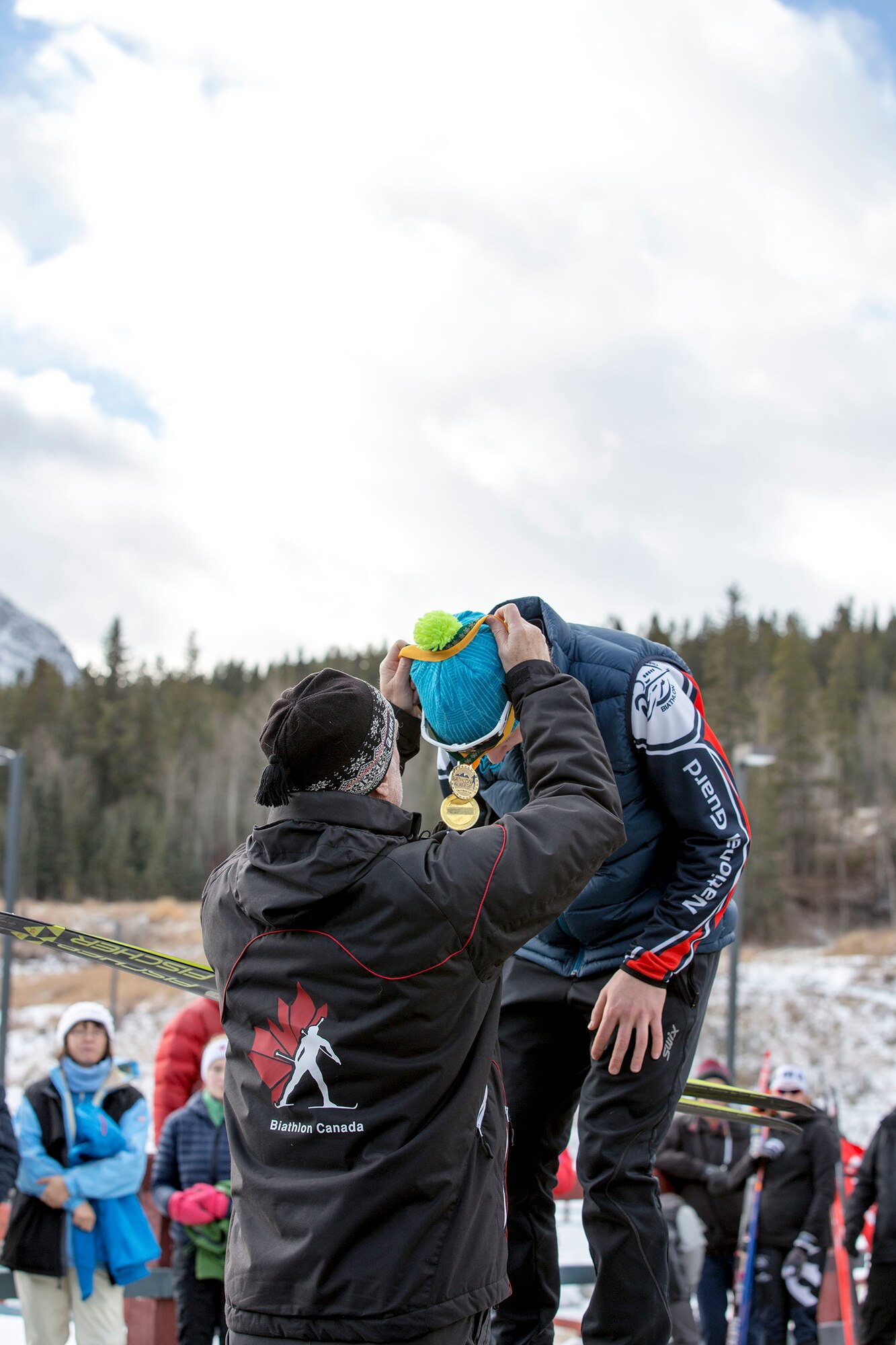 Alaska Army Guardsman Pfc. Travis Cooper, a construction equipment mechanic with the 207th Engineer Utility Detachment, claims his gold after completing the junior men’s 10 km sprint in the North American #1 and Calforex #1 Biathlon Cups at the Canmore Nordic Centre Provincial Park in Canmore, Alberta, Dec. 3, 2016. Cooper, 20, of Kenai, also took first place in the junior men’s 12.5 km mass start the following day. Cooper trains year-round and competes on the National Guard Biathlon development team. (U.S. Army National Guard photo by Staff Sgt. Balinda O’Neal Dresel)