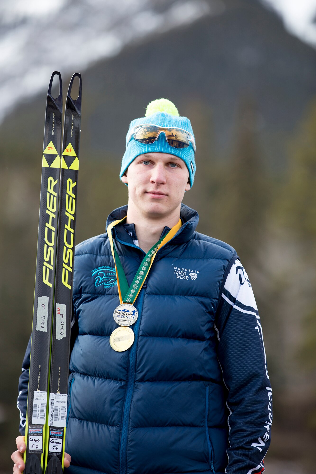 Alaska Army Guardsman Pfc. Travis Cooper, a construction equipment mechanic with the 207th Engineer Utility Detachment, claims his gold after completing the junior men’s 10 km sprint in the North American #1 and Calforex #1 Biathlon Cups at the Canmore Nordic Centre Provincial Park in Canmore, Alberta, Dec. 3, 2016. Cooper, 20, of Kenai, also took first place in the junior men’s 12.5 km mass start the following day. Cooper trains year-round and competes on the National Guard Biathlon development team. (U.S. Army National Guard photo by Staff Sgt. Balinda O’Neal Dresel)