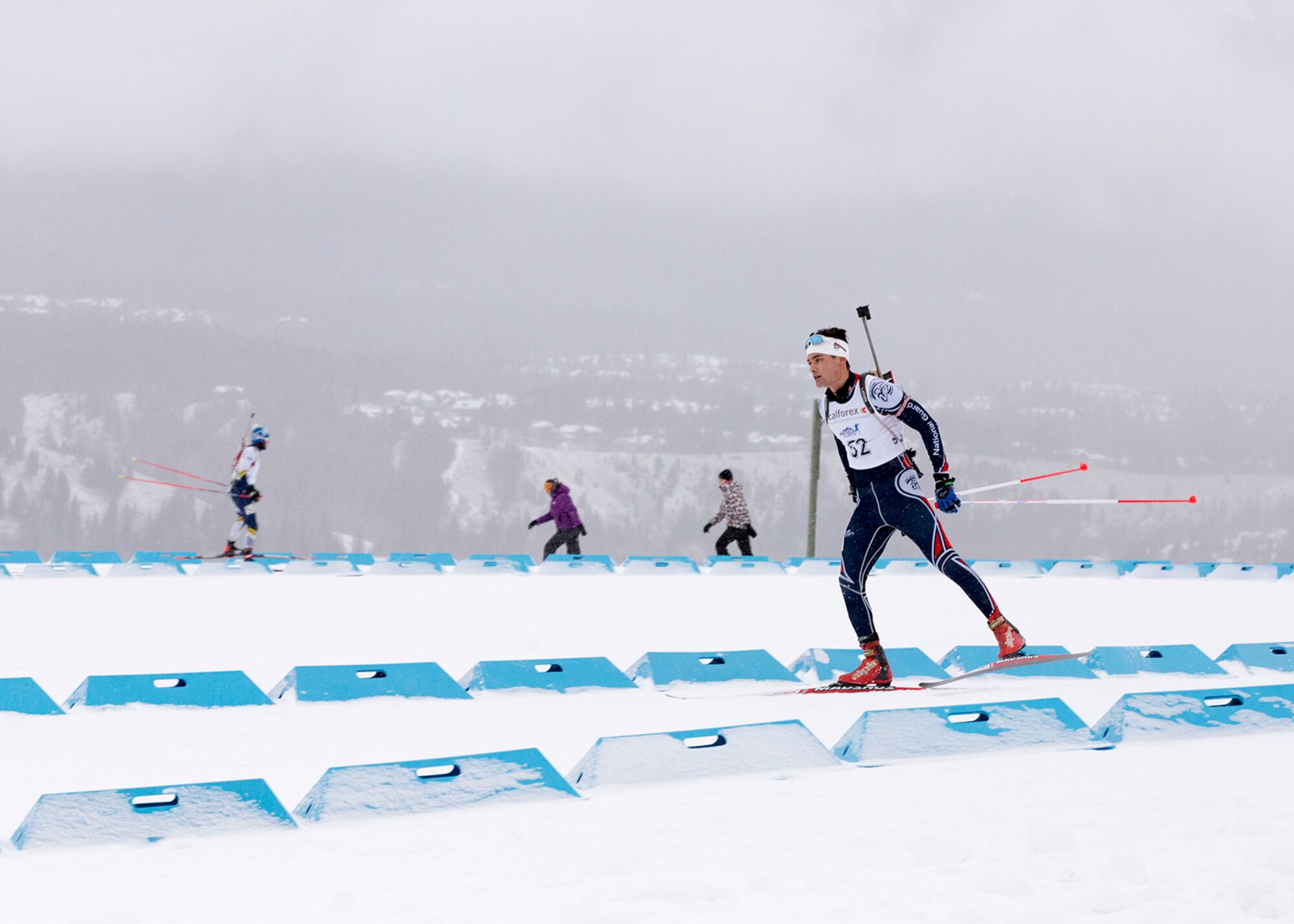 Alaska Guardsman Spc. Tahdg Nakada, a signal support specialist with Headquarters and Headquarters Company, 1st Battalion, 207th Aviation Regiment, competes in the North American #1 and Calforex #1 Biathlon Cups at the Canmore Nordic Centre Provincial Park in Canmore, Alberta, Dec. 4, 2016. Nakada, 22, of Anchorage, placed 15th overall in both the men’s 10 km sprint and 15 km mass start during the two-day competition. (U.S. Army National Guard photo by Staff Sgt. Balinda O’Neal Dresel)