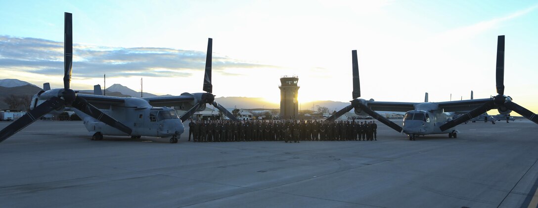 Marines with Marine Medium Tiltrotor Squadron (VMM) 161 gather around MV-22B Ospreys on Creech Air Force Base, Nev., Dec. 13. The squadron completed a two-week deployment for training exercise to prepare for their deployment with the 15th Marine Expeditionary Unit next year. (U.S. Marine Corps photo by Cpl. Kimberlyn Adams/Released)