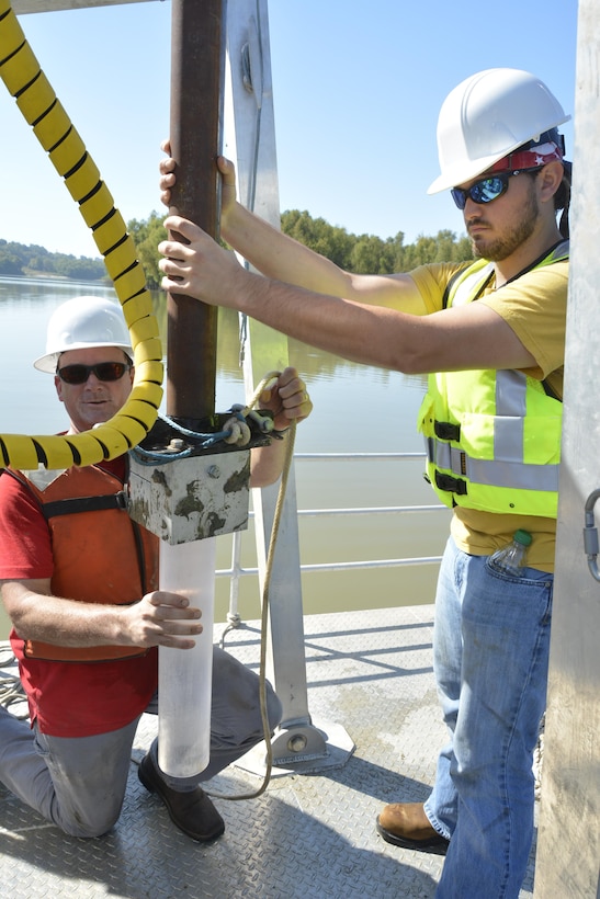 Jarrell Smith and Brandon Boyd prepare to take a core sample during a test run of the Coastal and Hydraulics Laboratory’s new coring barge, which allows core sampling in areas previously inaccessible to researchers. 