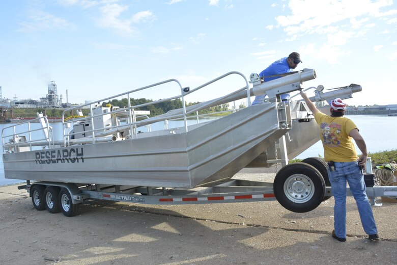 Mike Kirklin and Brandon Boyd, researchers from ERDC’s Coastal and Hydraulics Laboratory, prepare to launch a new specially-designed coring barge in Vicksburg, Mississippi. The barge provides new capabilities to U.S. Army Corps of Engineers’ scientists and engineers.