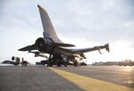 U.S. Air Force Airman 1st Class Eric Chung, left, a crew chief, and Staff Sgt. Esteban Ramirez, right, an engines technician, both with the 14th Aircraft Maintenance Unit, perform maintenance underneath an F-16 Fighting Falcon at Misawa Air Base, Japan, Dec. 12, 2016. Several shops from the 35th Aircraft Maintenance Squadron work with each other to perform their specialized craft on the aircraft. Airmen performed maintenance through engine panels in an F-16, allowing personnel to troubleshoot an engine without removing it.