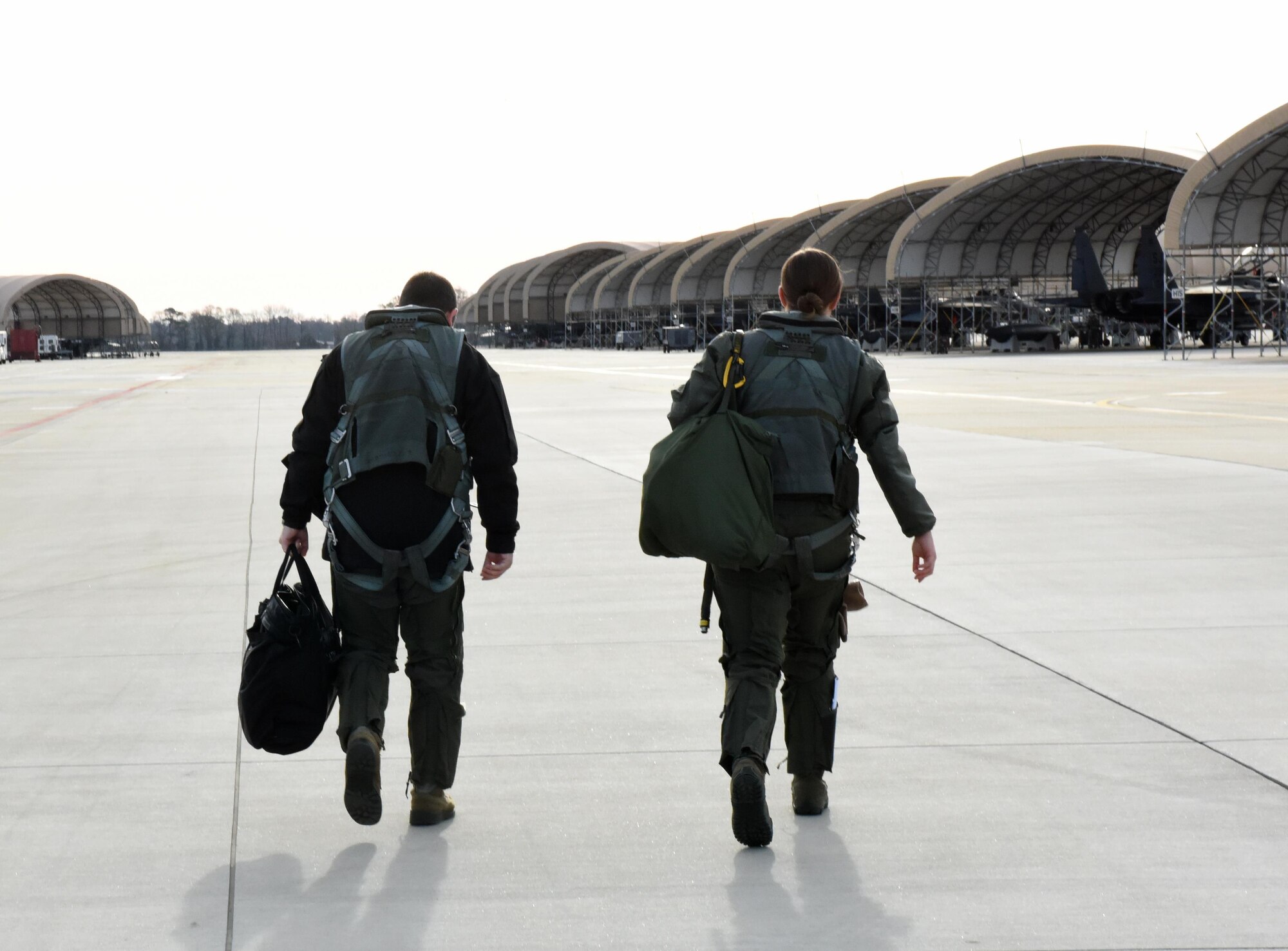 Capt. Brian Pascuzzi (left), 336th Fighter Squadron pilot, and 1st Lt. Jessica Niswonger (right), 336th FS weapons systems officer, step to a F-15E Strike Eagle to participate in Razor Talon, Dec. 16, 2016, at Seymour Johnson Air Force Base, North Carolina. Razor Talon is a low-cost, large-force training exercise for joint East Coast tactical and support aviation units. (U.S. Air Force photo by Airman Miranda A. Loera)