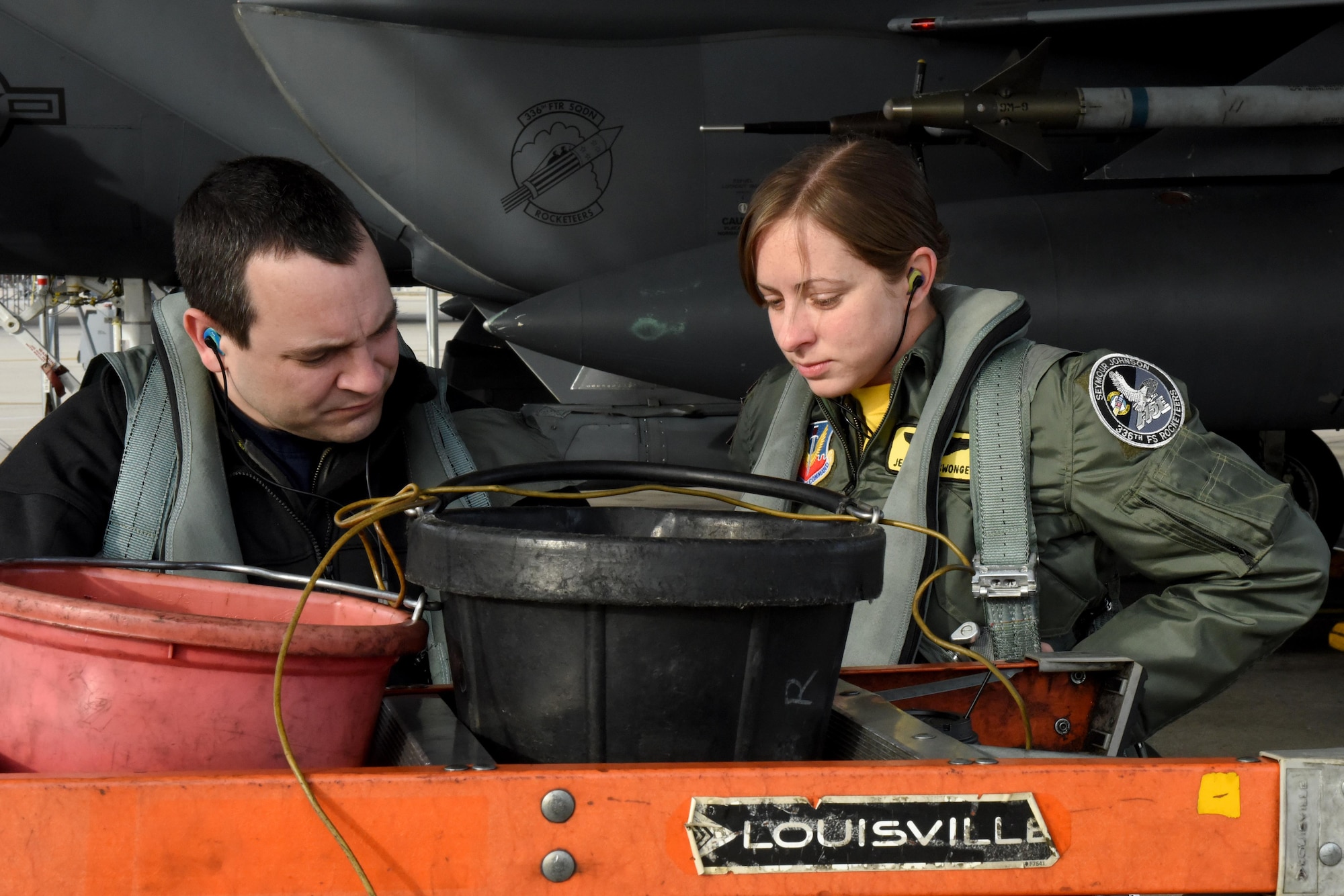 Capt. Brian Pascuzzi (left), 336th Fighter Squadron pilot, and 1st Lt. Jessica Niswonger (right), 336th FS weapons systems officer, prepare to fly an F-15E Strike Eagle as part of Razor Talon, Dec. 16, 2016, at Seymour Johnson Air Force Base, North Carolina. The monthly exercise allows service members unique opportunities to combine land, air and sea forces from all service branches in a realistic training environment. (U.S. Air Force photo by Airman Miranda A. Loera)