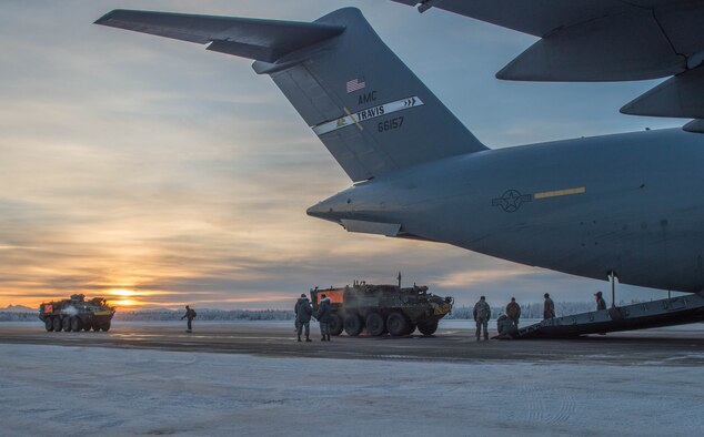 Stryker armored vehicles from the 1st Stryker Brigade Combat Team, 25th Infantry Division are loaded onto a C-17 Globemaster III Dec. 13, 2016, at Eielson Air Force Base, Alaska. A contingency response team was sent to Eielson AFB to support the Army’s Rapid Alaska Airlift Week exercise. (U.S. Air Force photo/Staff Sgt. Robert Hicks)