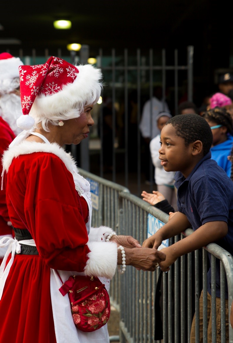 Mrs. Claus speaks with a child who has been eagerly waiting in line to get a bicycle at New Orleans City Hall for the Zulu Social Aid and Pleasure Club’s annual Toys for Tots distribution, Dec. 17, 2016. Nearly 2,000 families lined up to receive toys and gifts. Toys for Tots, an annual Marine Corps Reserve program, aims at collecting new, unwrapped Christmas gifts for less fortunate children in the community. Since its inception in 1947, Toys for Tots has distributed 512 million toys to 237 million children.