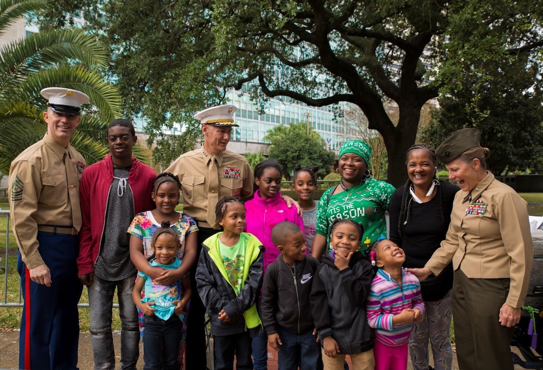 Sgt. Maj. Patrick L. Kimble (left), sergeant major of Marine Forces Reserve, Lt. Gen. Rex C. McMillian (middle), commander of MFR and Marine Forces North, and Brig. Gen. Helen G. Pratt (right), commanding general of 4th Marine Logistics Group, speak with families waiting in line to receive bicycles and other gifts at the Zulu Social Aid and Pleasure Club’s annual Toys for Tots distribution at New Orleans City Hall, Dec. 17, 2016. Nearly 2,000 families lined up to receive toys and gifts. Toys for Tots, an annual Marine Corps Reserve program, aims at collecting new, unwrapped Christmas gifts for less fortunate children in the community. Since its inception in 1947, Toys for Tots has distributed 512 million toys to 237 million children.