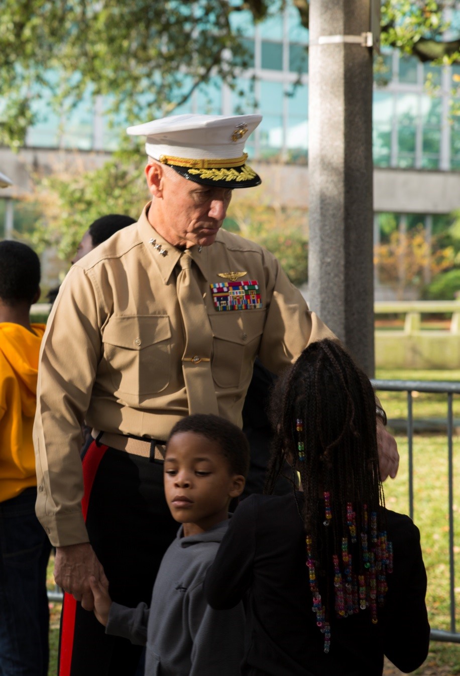 Lt. Gen. Rex C. McMillian, commander of Marine Forces Reserve and Marine Forces North, speaks with children as they wait to receive gifts during the annual Zulu Social Aid and Pleasure Club’s Toys for Tots distribution at New Orleans City Hall, Dec. 17, 2016. Nearly 2,000 families lined up to receive toys and gifts. Toys for Tots, an annual Marine Corps Reserve Program, aims at collecting new, unwrapped Christmas gifts for less fortunate children in the community in which the campaign is conducted. Since its inception in 1947, Toys for Tots has distributed 512 million toys to 237 million children.