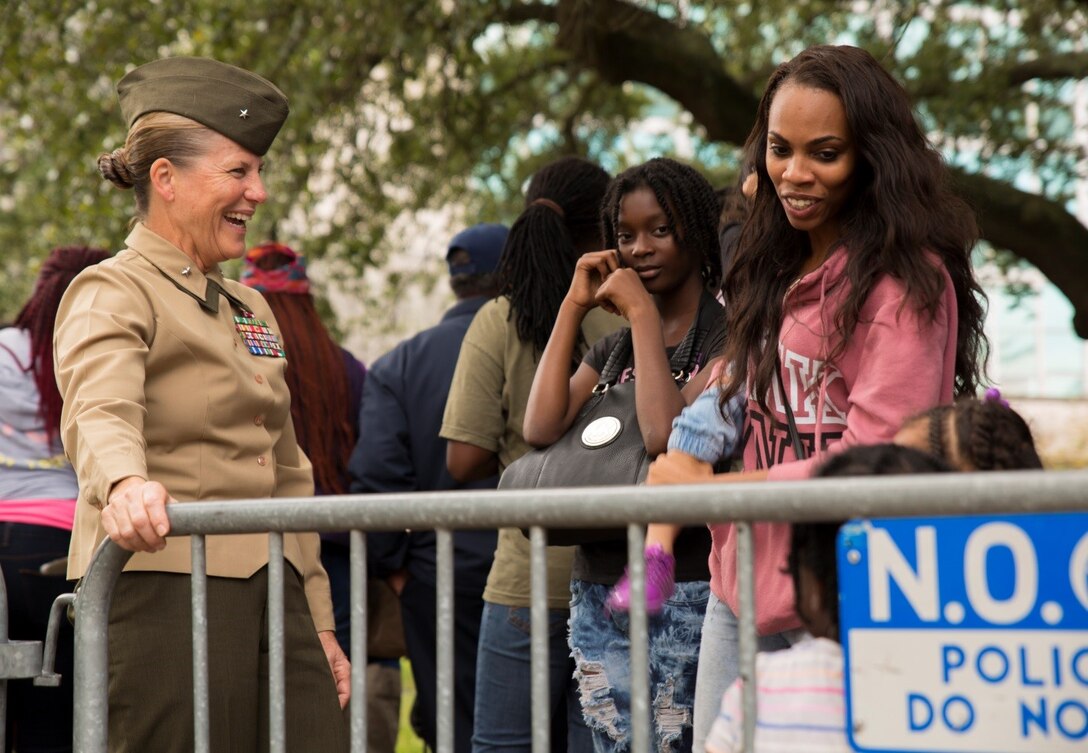 Brig. Gen. Helen G. Pratt, commanding general of 4th Marine Logistics Group, converses with a family who has been waiting to receive gifts from the Zulu Social Aid and Pleasure Club’s annual Toys for Tots distribution, Dec. 17, 2016. Nearly 2,000 families lined up to receive toys and gifts. Toys for Tots, an annual Marine Corps Reserve program, aims at collecting new, unwrapped Christmas gifts for less fortunate children in the community. Since its inception in 1947, Toys for Tots has distributed 512 million toys to 237 million children.