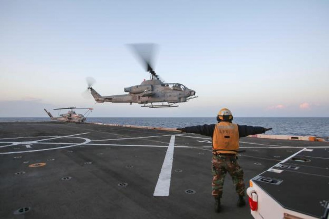 An AH-1W Super Cobra from the 22nd Marine Expeditionary Unit lands aboard the amphibious transport dock ship USS San Antonio in the Mediterranean Sea, Nov. 18, 2016. The 22nd MEU conducted precision airstrikes in support of the Libyan Government of National Accord-aligned forces against the Islamic State of Iraq and the Levant targets in Sirte, Libya, as part of Operation Odyssey Lightning. Marine Corps photo by Sgt. Ryan Young