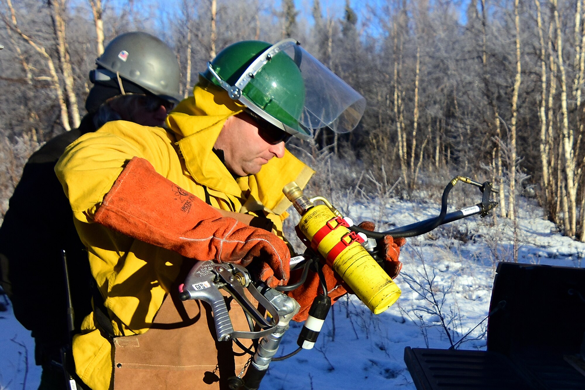 Bureau of Land Management Alaska Fire Service specialist Bob Schober prepares the Terra Torch for work as part of a prescribed burn project in U.S. Army Alaska’s Donnelly Training Area near Fort Greely Nov. 4, 2016. AFS provides wildland fire management for 1.6 million acres of military withdrawn public land under an interagency service agreement with U.S. Army Alaska. (Army photo/John Pennell)