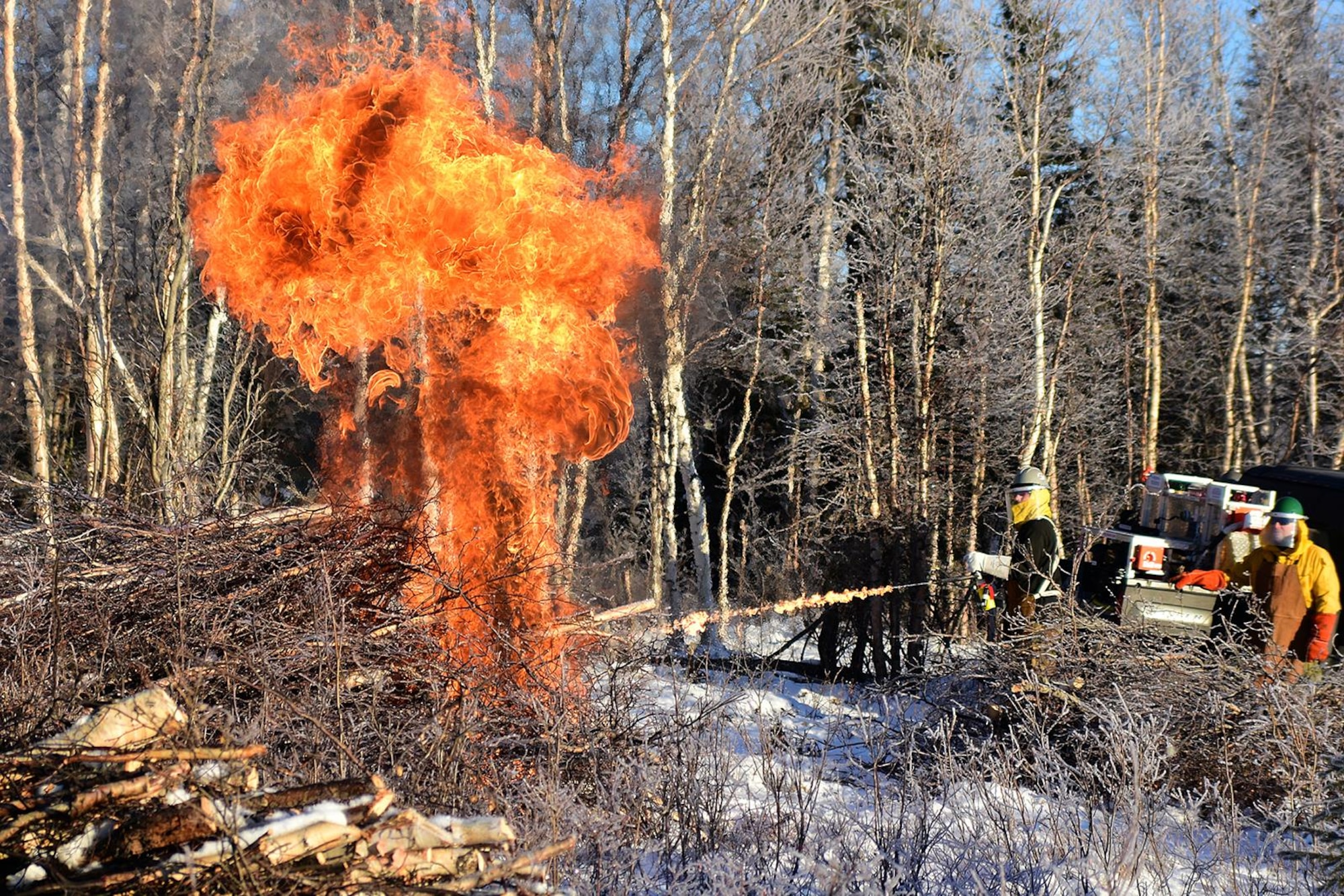 Bureau of Land Management Bureau of Land Management Alaska Fire Service specialist Matt Kilgriff shoots a stream of flaming gel from the Terra Torch to burn piles of brush and trees as part of a prescribed burn project in U.S. Army Alaska’s Donnelly Training Area near Fort Greely Nov. 4, 2016. The piles were created by U.S. Army Alaska hand crews working to remove dead and decaying vegetation and black spruce in an effort to reduce the chances of a wildfire on military lands. AFS provides wildland fire management for 1.6 million acres of military withdrawn public land under an interagency service agreement with U.S. Army Alaska. (Army photo/John Pennell)