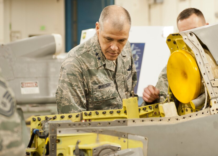 Maj. Gen. Thomas Bussiere, 8th Air Force commander, views an AGM-86 Air Launched Cruise Missile at Minot Air Force Base, N.D., Dec. 14, 2016. Bussiere toured Minot’s facilities, including the 705th Munitions Squadron, and spoke with 5th Bomb Wing Airmen. (U.S. Air Force photo/Airman 1st Class J.T. Armstrong) 
