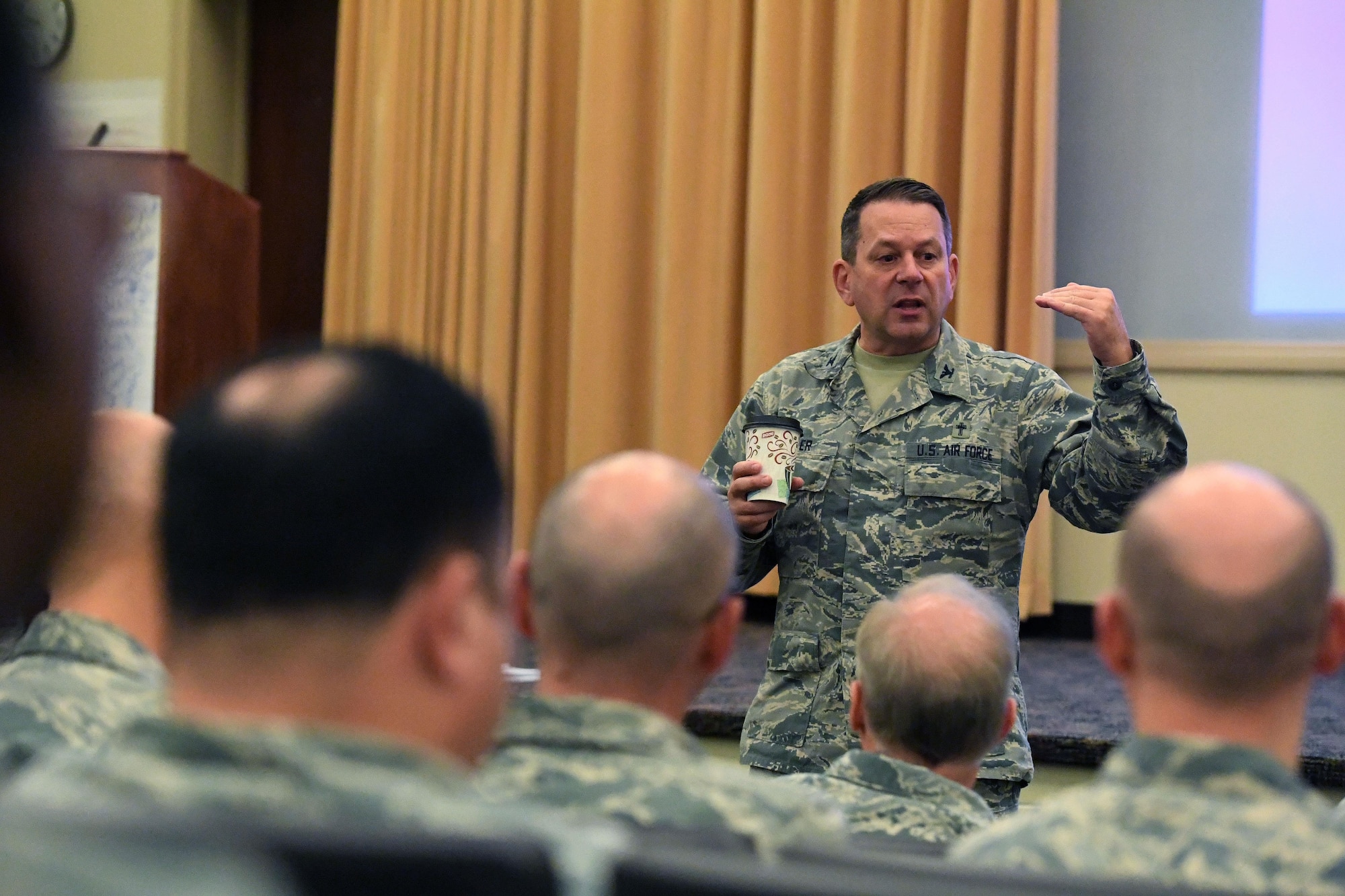 Chaplain (Col.) Timothy Butler, Air Combat Command Chaplain, speaks to chaplains from across the command at an ACC Chaplain Corps Leadership Development Symposium Dec. 8, 2016. The idea for the symposium formed when the command chaplains and their assistants from each of three MAJCOMs involved – USAFE, AETC and ACC – discovered they were all contemplating the same idea: how to improve leadership within the chaplain corps. (U.S. Air Force photo by Staff Sgt. Nick Wilson)