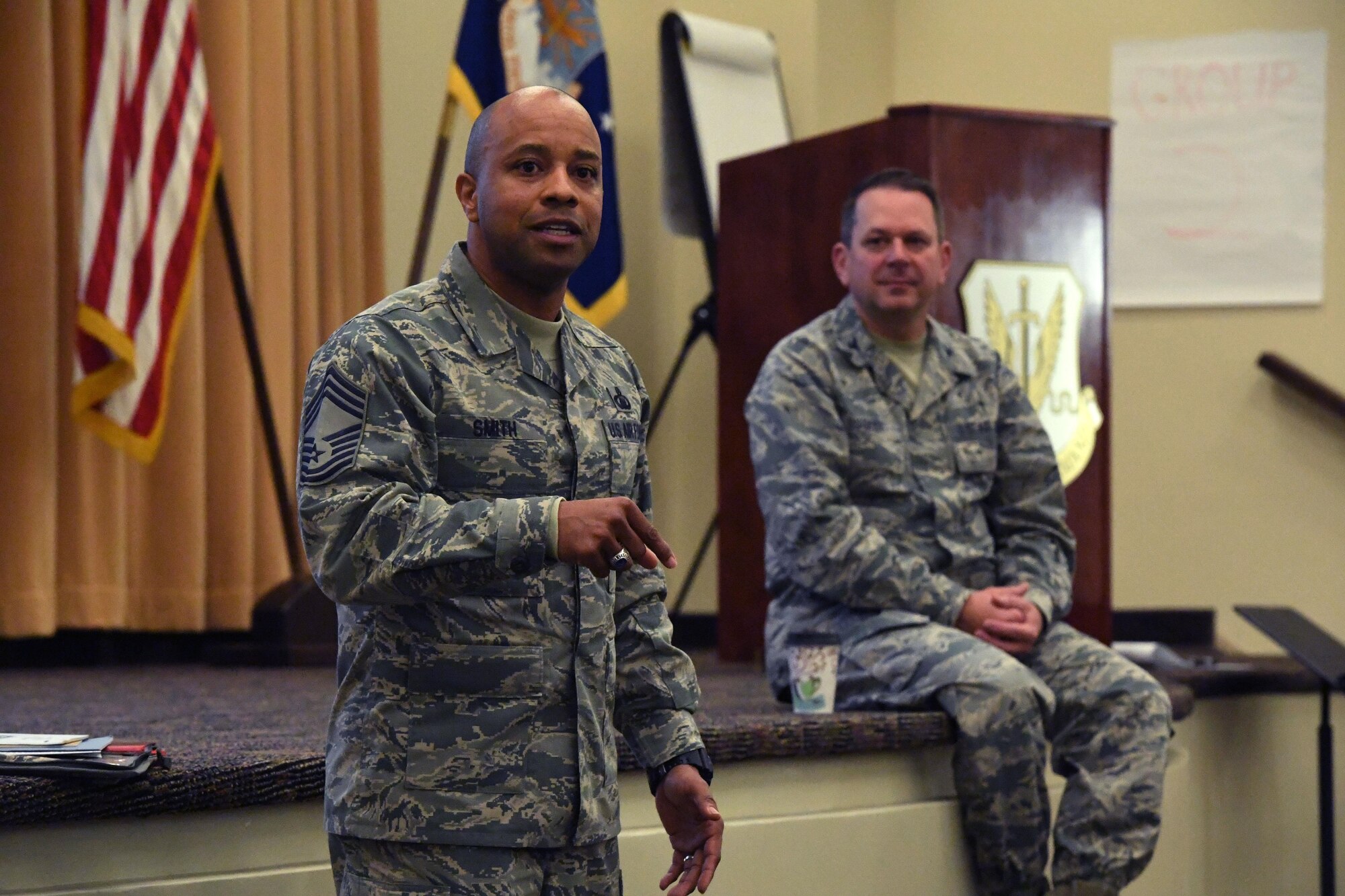 Chief Master Sgt. Antonio Smith, Air Combat Command chaplain assistant functional manager, speaks during an ACC Chaplain Corps Leadership Development Symposium Dec. 8, 2016. With an intent to allow chaplains to better serve the Air Force, Command chaplains and their chief chaplains’ aids from three major commands – U.S. Air Force in Europe, Air Education and Training Command and Air Combat Command – collaborated at the symposium. (U.S. Air Force photo by Staff Sgt. Nick Wilson)