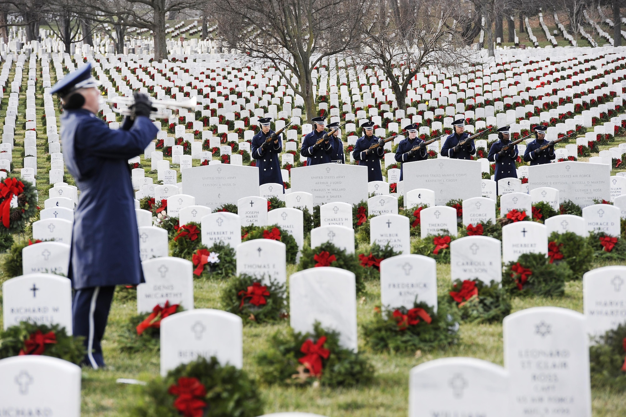 The U.S. Air Force Honor Guard performs a 21-gun salute during the interment of Maj. Troy Gilbert at Arlington National Cemetery, Va., Dec. 19, 2016. Gilbert’s family and more than 300 friends, colleagues and wingmen attended the funeral to pay their respects and honor the fallen Airman. (U.S. Air Force photo/Staff Sgt. Jannelle McRae)