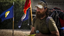 Jon Hancock, a Marine veteran, gives a speech to fellow veterans, active duty Marines, family and friends in Marine Corps Base Camp Pendleton, Calif., Dec. 11, 2016. Hancock walked across the country from Maryland to California honoring his fallen brothers and raising awareness for veterans. Marines with 2nd Battalion, 4th Marine Regiment held a ceremony honoring Hancock’s long trip.  (U.S. Marine Corps photo by Lance Cpl. Frank Cordoba)