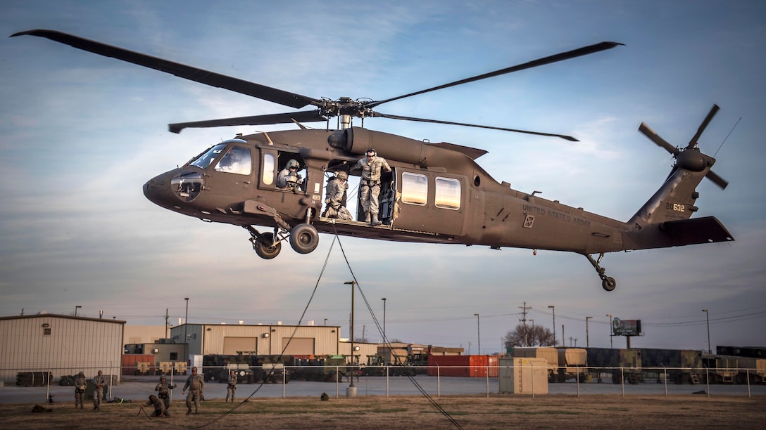 Airmen rappel from a UH-60 Black Hawk helicopter during annual rappelling refresher training in Tulsa, Okla., Dec. 14, 2016. Air National Guard photo by Tech. Sgt. Drew A. Egnoske