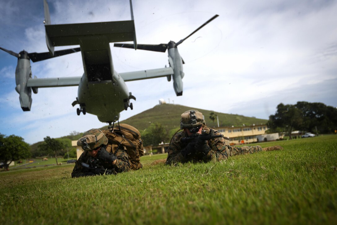 Marines provide security after offloading from an MV-22 Osprey during a simulation of Operation Gothic Serpent, a 1993 operation in Somalia, at Marine Corps Base Hawaii, Dec. 10, 2016. Marine Corps photo by Cpl. Aaron S. Patterson