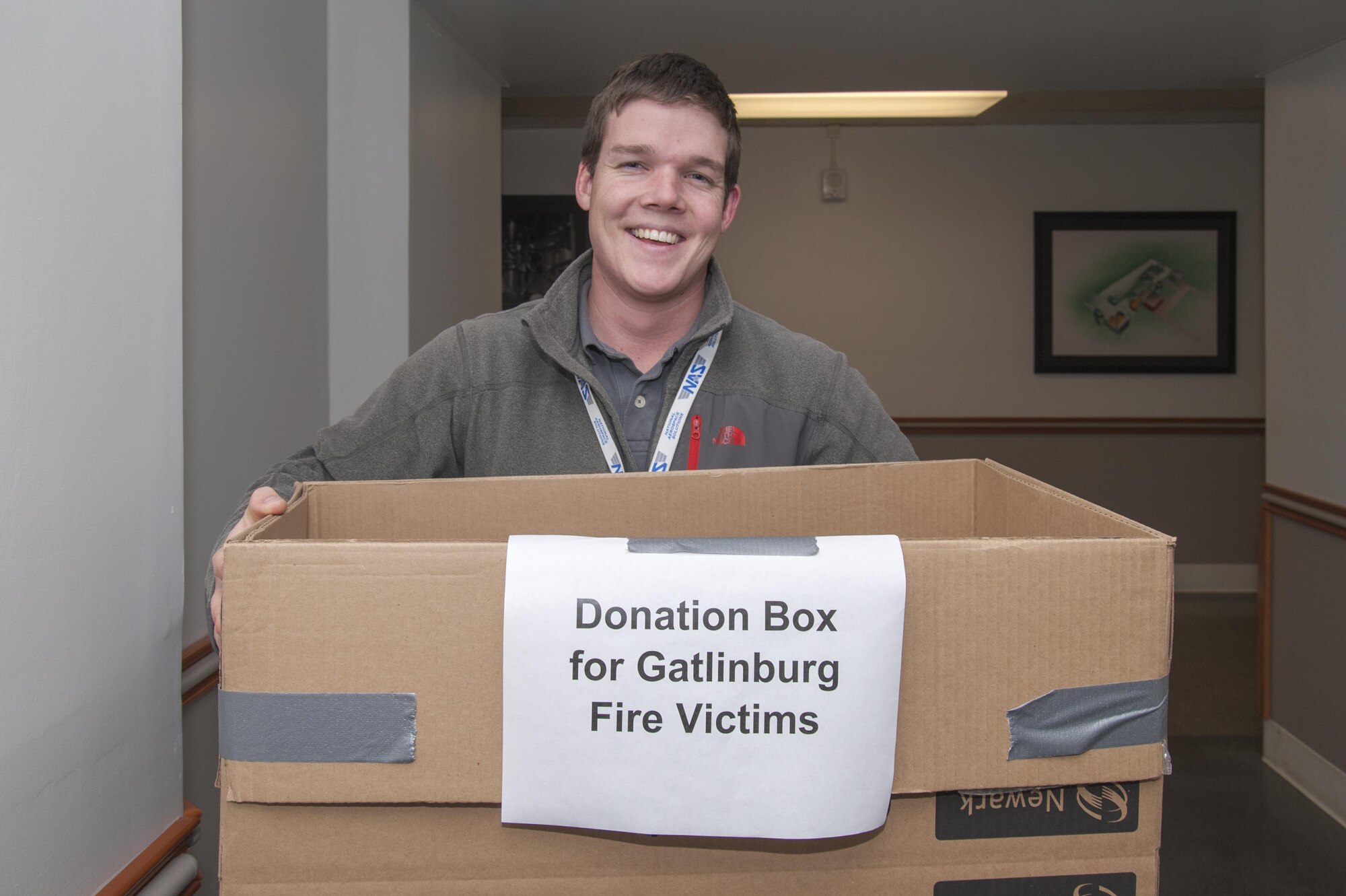 Kevin Brown, Propulsion Wind Tunnel mechanical system engineer, collects donations in the Administration and Engineering building at Arnold Engineering Development Complex Dec. 8 for Sevier County officials, in efforts to help the Gatlinburg fire victims. Donations requested include items such as baby supplies, personal hygiene, food, clothes, medicine and other miscellaneous items. Donations were delivered to the Sevier County University of Tennessee Extension Office Dec. 10. (U.S. Air Force photo/Jacqueline Cowan)
