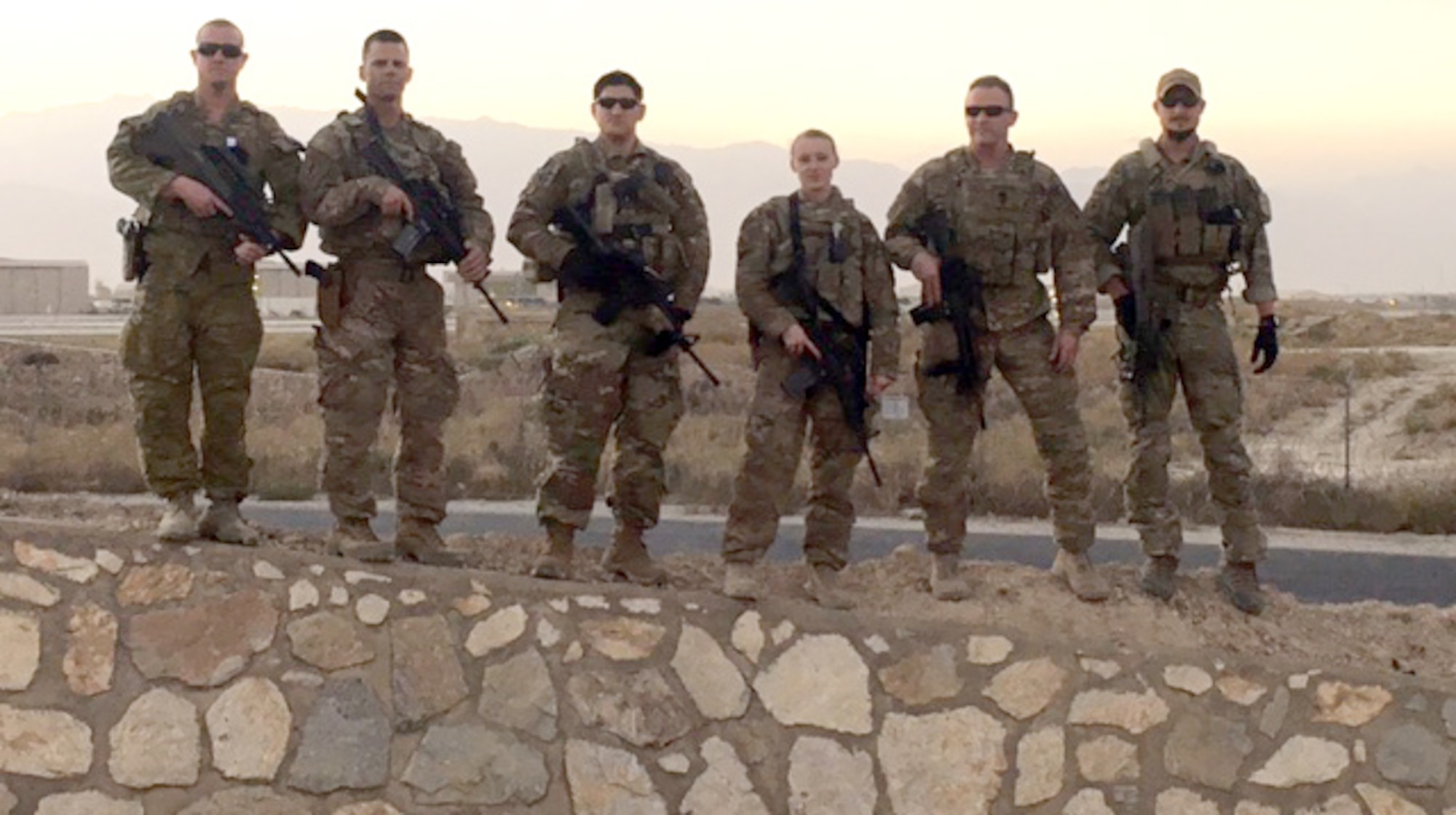 Airman 1st Class Corynn Marcelo stands on Russian ruins with her Team from the Camp Vance Aid Station during her deployment. From left to right - Petty Officer Simon Eden, Australian senior medic; Capt. Jason Mitchler, physical therapist; Maj. Jeffery Berwell, medical planner; Marcelo; Lt. Col. Gerald Surrett, command surgeon; and Georg Schallegger, Austrian special operations medic. (Courtesy photo)