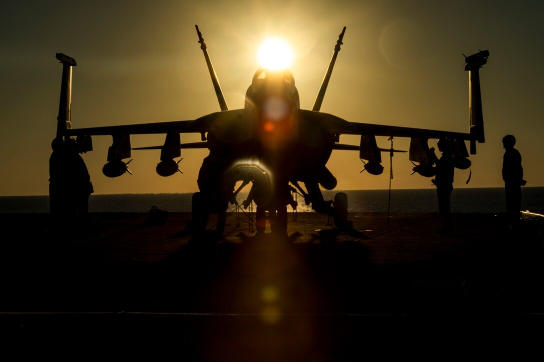 Sailors tie an F/A-18E Super Hornet to the flight deck of the aircraft carrier USS Dwight D. Eisenhower in the Mediterranean Sea, Dec. 11, 2016. The aircraft is assigned to Strike Fighter Squadron 86. Navy photo by Petty Officer 3rd Class Nathan T. Beard