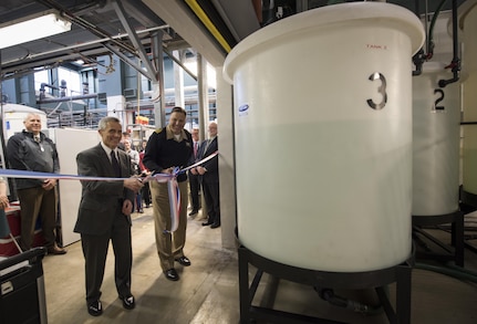 Naval Surface Warfare Center, Carderock Division  Commanding Officer Capt. Mark Vandroff (right) and Technical Director Dr. Joseph (Tim) Arcano officially open the Ballast Water Research Lab in West Bethesda, Md., Dec. 5, 2016. This new facility provides the Navy with the capability to research, develop, test and evaluate solutions to eliminate or remove aquatic nuisance species from residual water and sedimentation that remain inside ships’ ballast tanks. The lab can also be used to investigate various ballast water-treatment components and sensors to evaluate their suitability for Navy-specific integration. (U.S. Navy photo by Monica McCoy/Released)